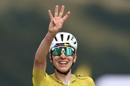 UAE Team Emirates - XRG's Slovenian rider Tadej Pogacar wearing the overall leader's yellow jersey cycles to the finish line to win the 14th stage of the 113th edition of the Tour de France cycling race, 155,3 km between Mulhouse and Le Markstein in the Vosges mountains, on July 18, 2026. (Photo by Anne-Christine POUJOULAT / AFP)