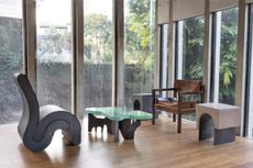 Modernist Brazilian furniture in brutalist house interior