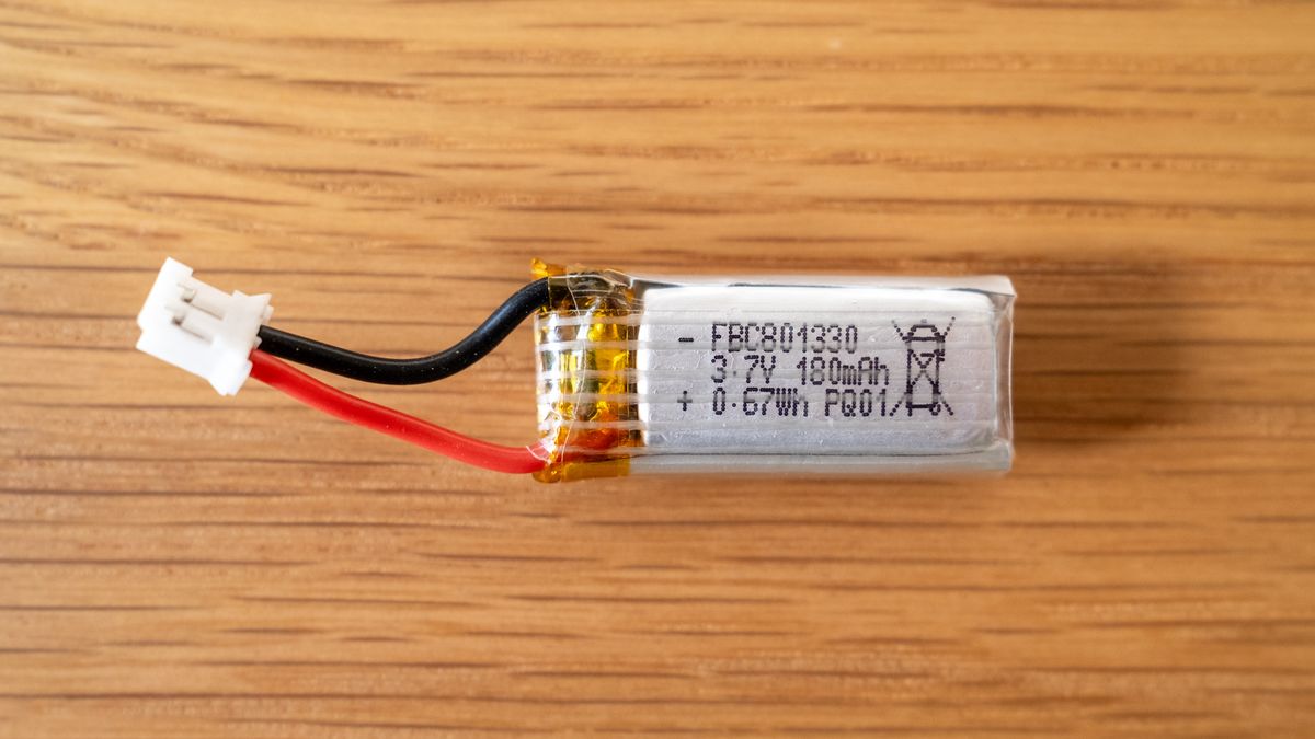 Potensic A20 Mini Drone battery on a wooden table