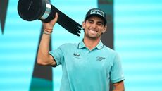 Joaquin Niemann with the LIV Golf Virginia trophy 