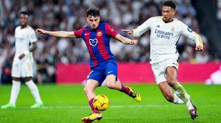 Barcelona's Pedri is challenged by Real Madrid's Jude Bellingham in a Clasico clash in LaLiga in April 2024.