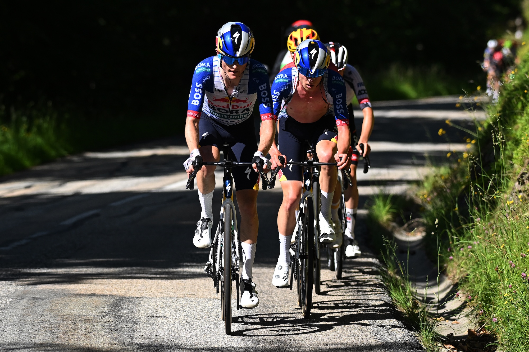 Luke Tuckwell of Australia and Maxim Van Gils of Belgium and Team Red Bull - BORA - hansgrohe compete in the breakaway during the 78th Tour Auvergne-Rhone-Alpes 2026, Stage 6