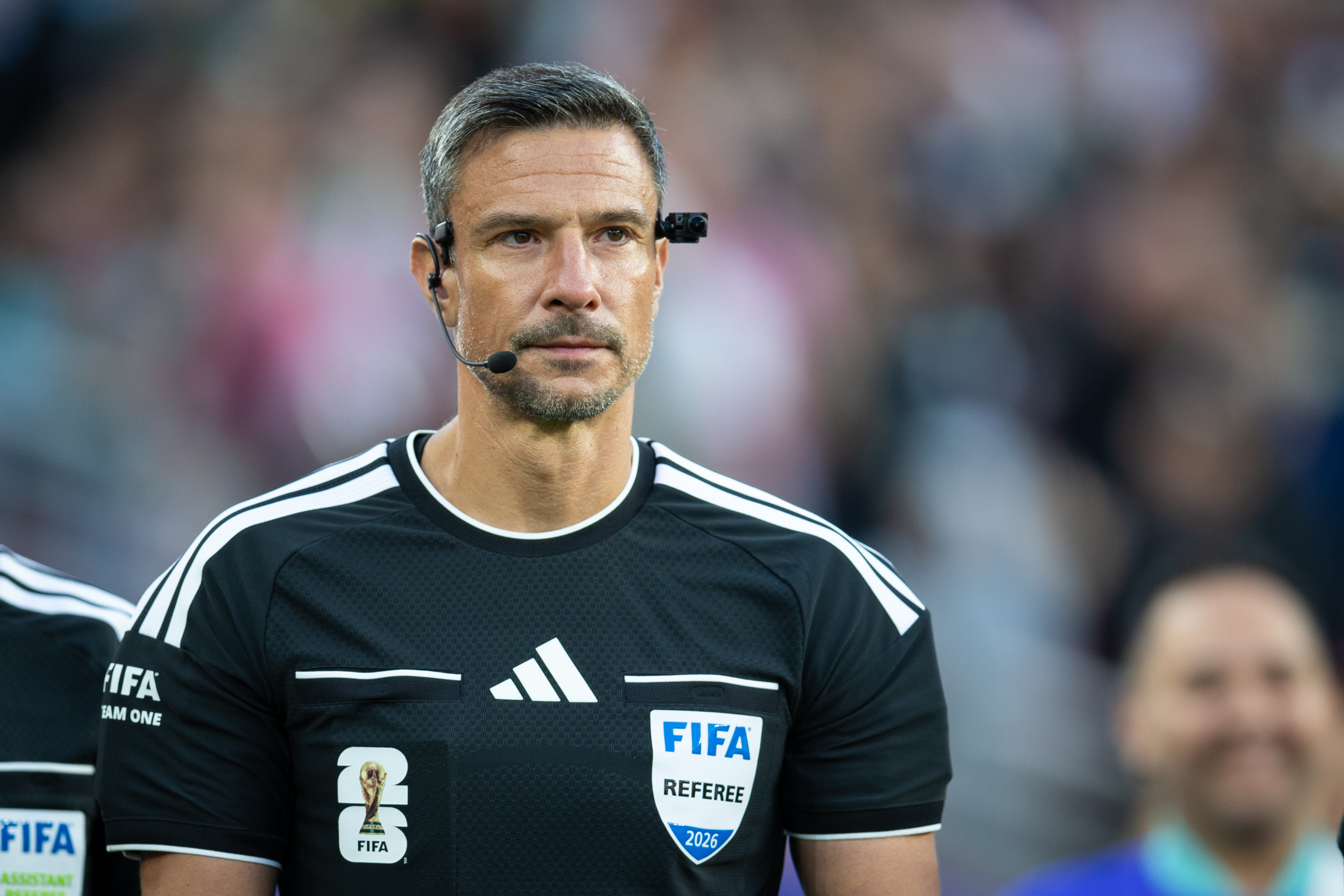 Referee Slavko Vinčić enters the field