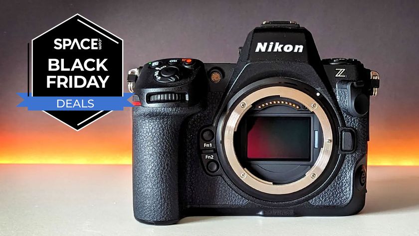 The Nikon Z8 on a white table with the Space.com Black Friday deal badge in the upper left corner.