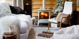 log burner in living room with white sofa