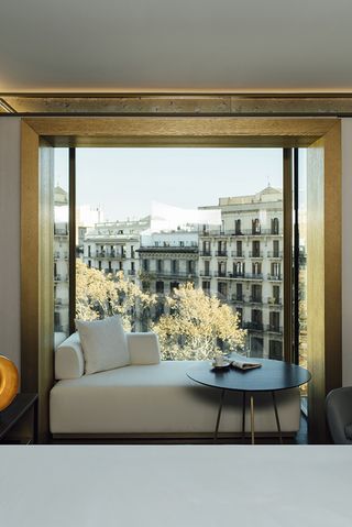 White sofa in window with scenic view