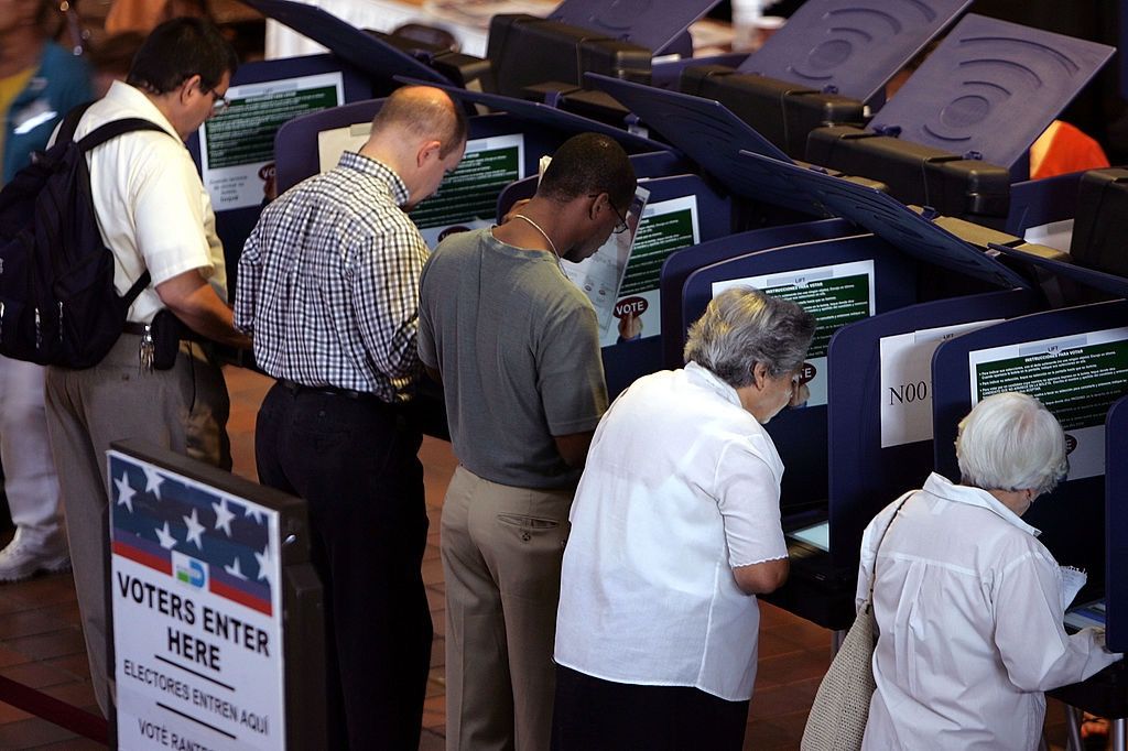 Residents of Miami-Dade in Florida cast their votes for president on electronic voting machines Oct. 28, 2004. 