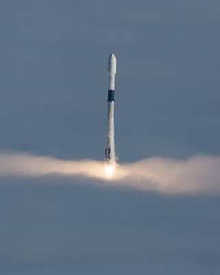 A SpaceX Falcon 9 rocket pierces through a layer of clouds after lifting off in the thick morning fog at Vandenberg Air Force Base in California on Wednesday (June 12). The rocket successfully delivered three Earth-observing satellites into Earth orbit for the Canadian Space Agency before returning to Earth to stick a landing.