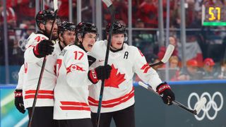 Macklin Celebrini #17 of Team Canada competes with teammates after scoring a goal