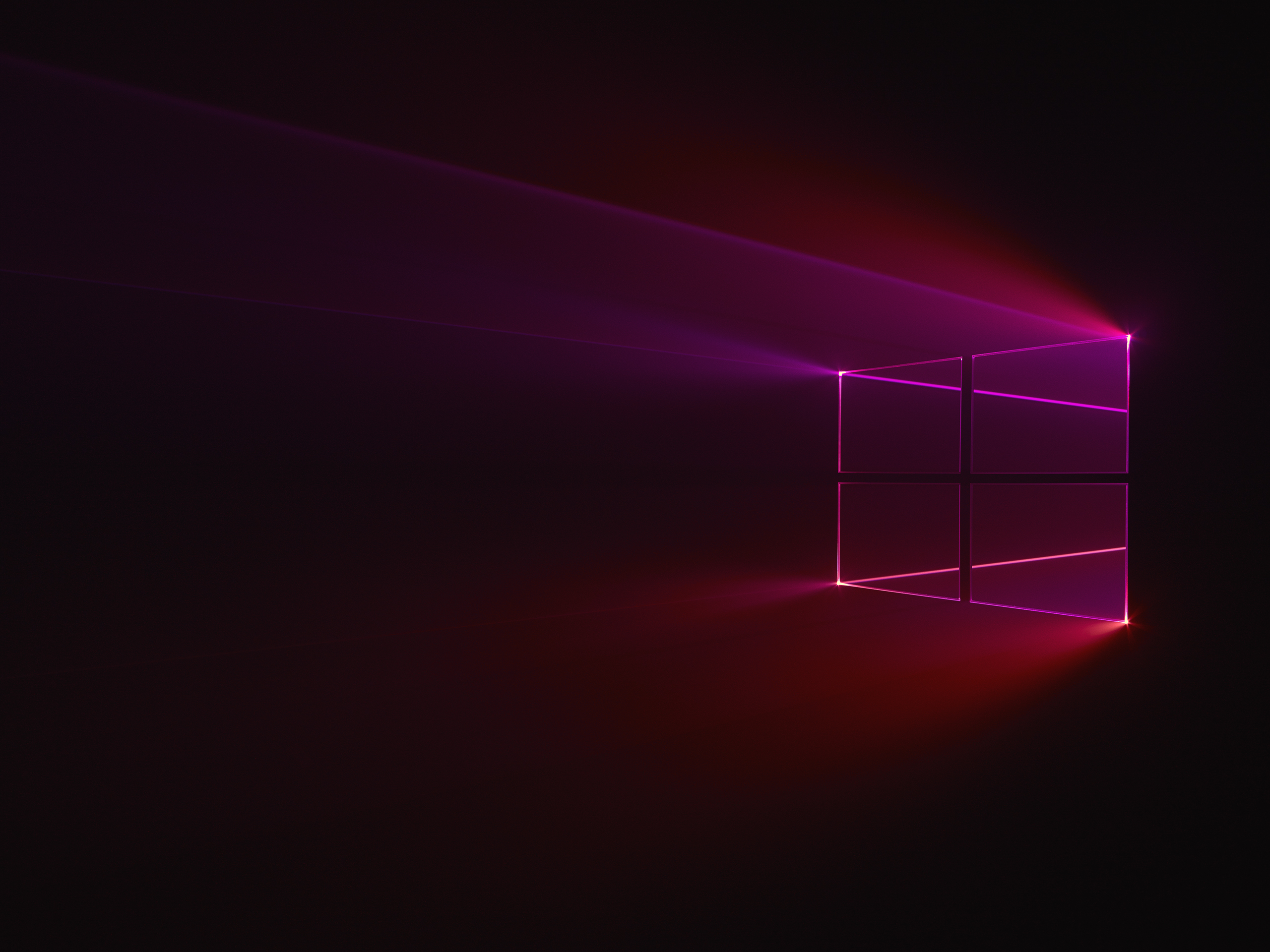 WIP versions of Windows 10 desktop background with light being filtered through a physical windows 10 logo