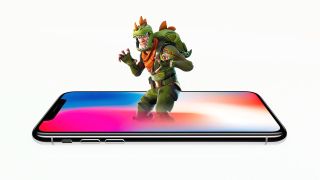 A photo illustration of a Fortnite: Battle Royale character in a dino-suit emerging from an iPhone X.