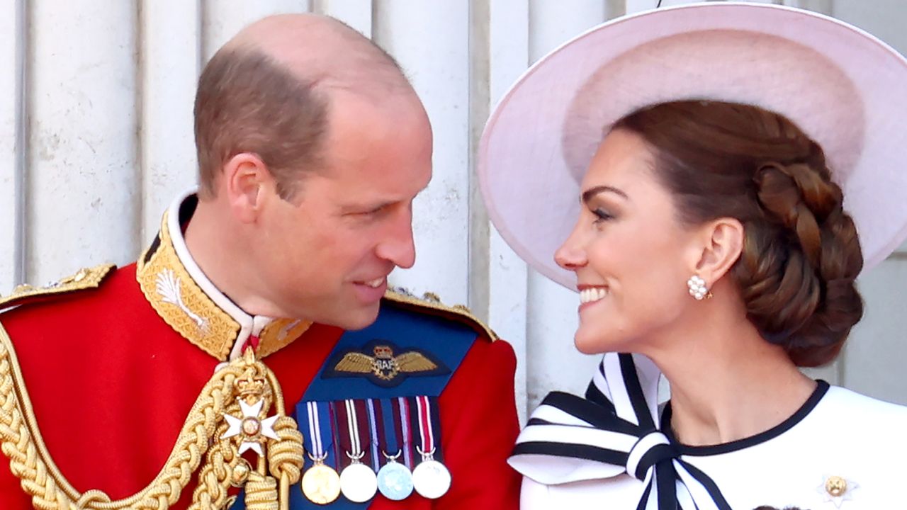 Prince William and Kate Middleton smiling at each other at Trooping the Colour 2024