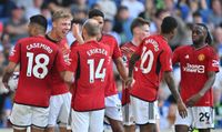 Manchester United players celebrate after victory over Brighton and Hove Albion.