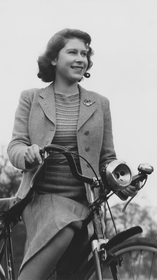 Princess Elizabeth cycling at the Royal Lodge in Windsor, UK, 4th April 1942