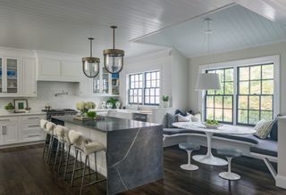 modern white kitchen with marble kitchen island by Liz Caan
