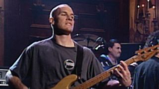 Tim Commerford playing bass guitar with Rage Against the Machine on SNL