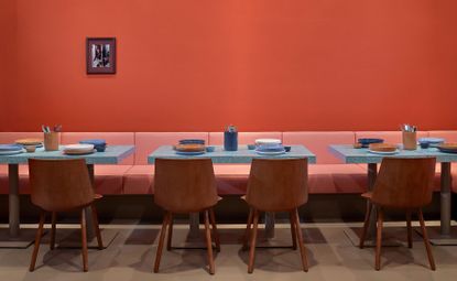 Restaurant interior with red walls & red seating