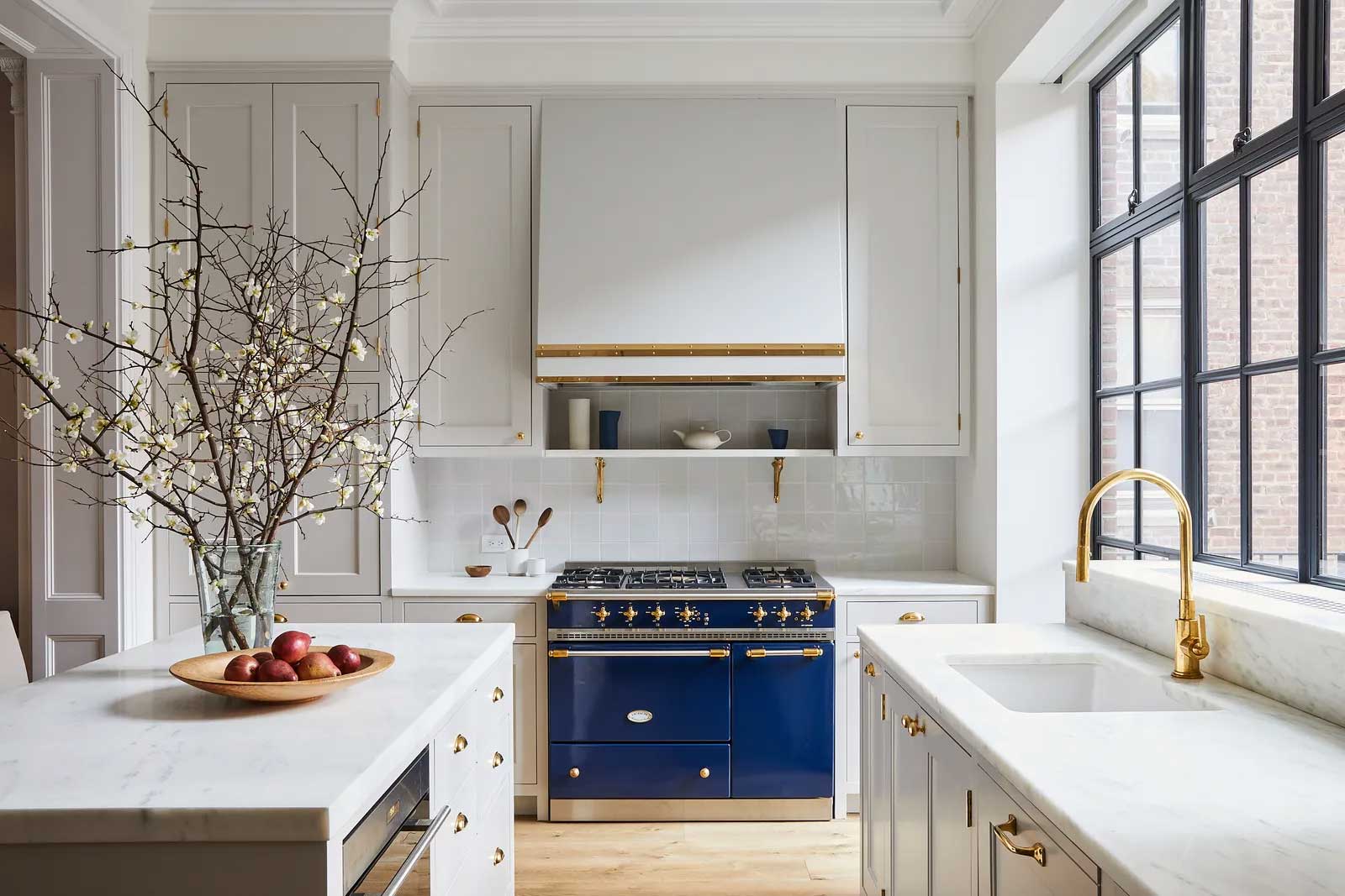 white kitchen with brass fixtures