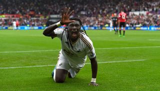 Bafetimbi Gomis celebrates after scoring for Swansea against Manchester United in 2015.