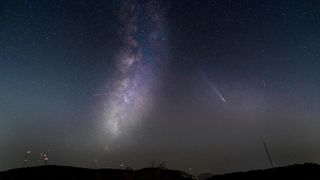 A photo of the ATLAS comet in the night sky