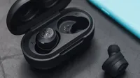 The JLab JBuds Air True wireless earbuds taken out of their charging case