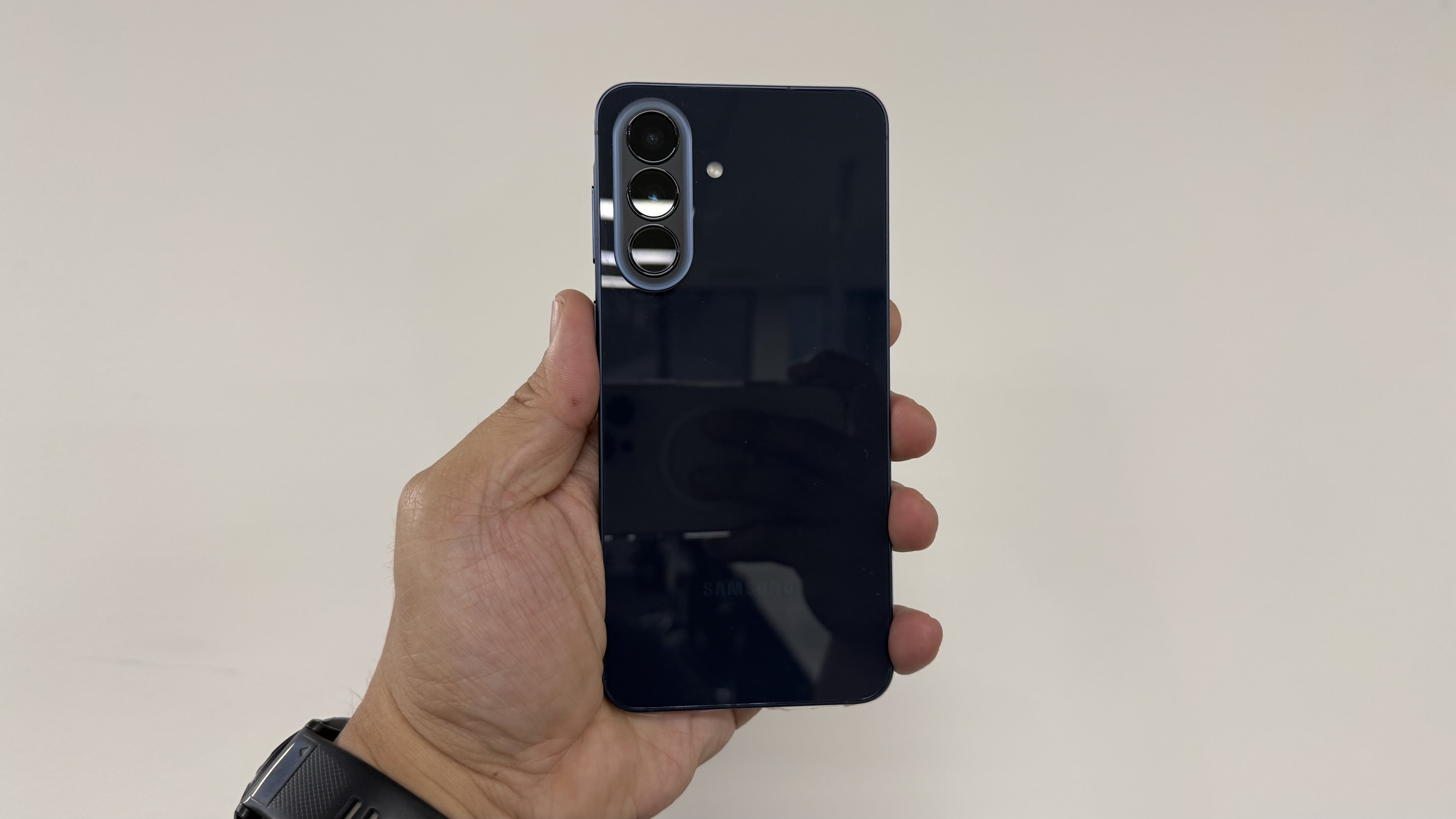 Samsung Galaxy A57 held up with the back facing