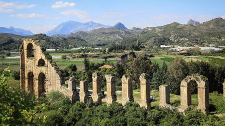 A series of stone pillars in the middle of a valley.