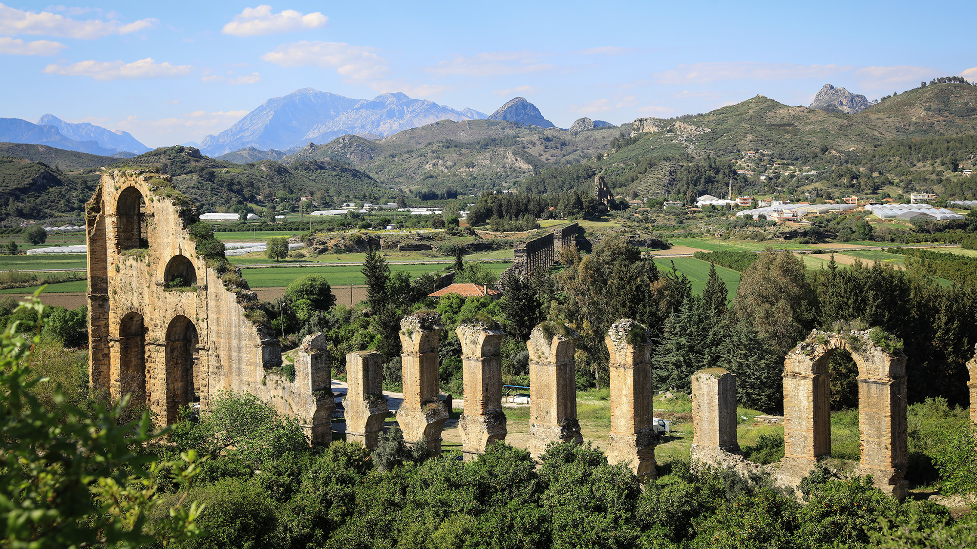A series of stone pillars in the middle of a valley.