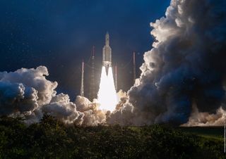 An Ariane 5 rocket lifts off from the Guiana Space Center near Kourou, French Guiana, carrying the Eutelsat Konnect and GSAT-30 communications satellites into orbit.