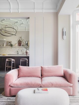 living room with pink sofa