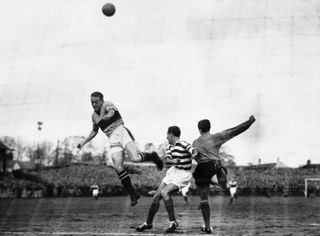 Ian St John jumps for the ball in a match between Motherwell and Kilmarnock in February 1960.