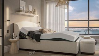 Dreams Chloe Boucle Bed with the matching footstool in a light bedroom with big windows