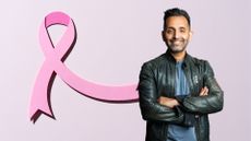 Dr Amir Khan standing next to pink ribbon for Breast Cancer Awareness