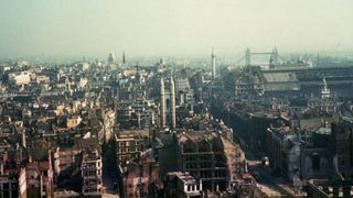 A view east from the Temple area of London, after German bombing raids during the blitz, circa 1941. On the right are the Monument to the Great Fire of London, Cannon Street station and the Tower of London. 