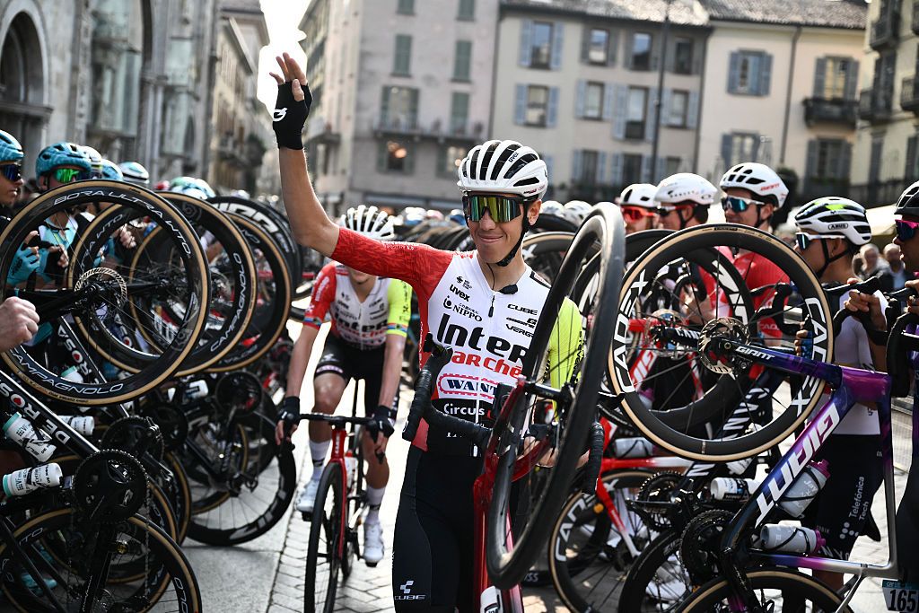 Intermarche&ndash;Wanty&rsquo;s Italian rider Simone Petilli walks past riders lining the start line to celebrate his last race, ahead of the 119th edition of the Giro di Lombardia (Tour of Lombardy), a 238km cycling race from Como to Bergamo on October 11, 2025. (Photo by Marco BERTORELLO / AFP)