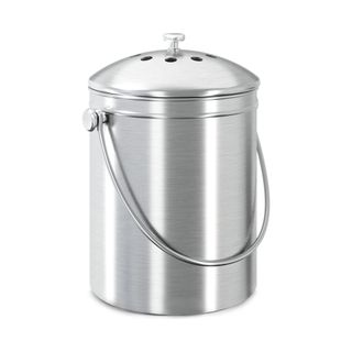 A silver cylinder shaped compost bin with a curved handle and a lid