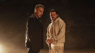 (L-R) John Turturro as “Boz” and Orlando Bloom as “Boxer” in the Psychological Thriller film, THE CUT.