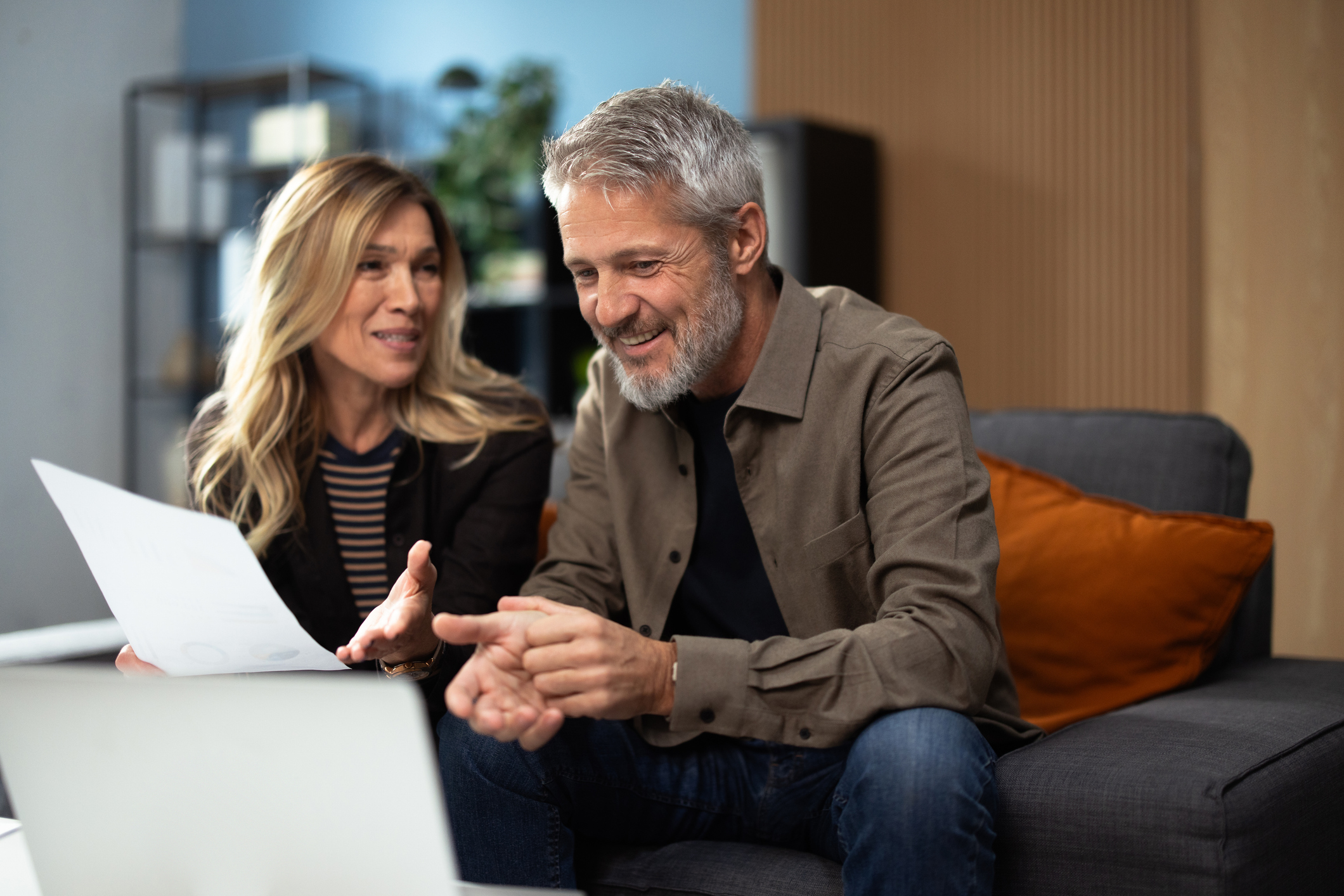 a man and woman going over financial plans