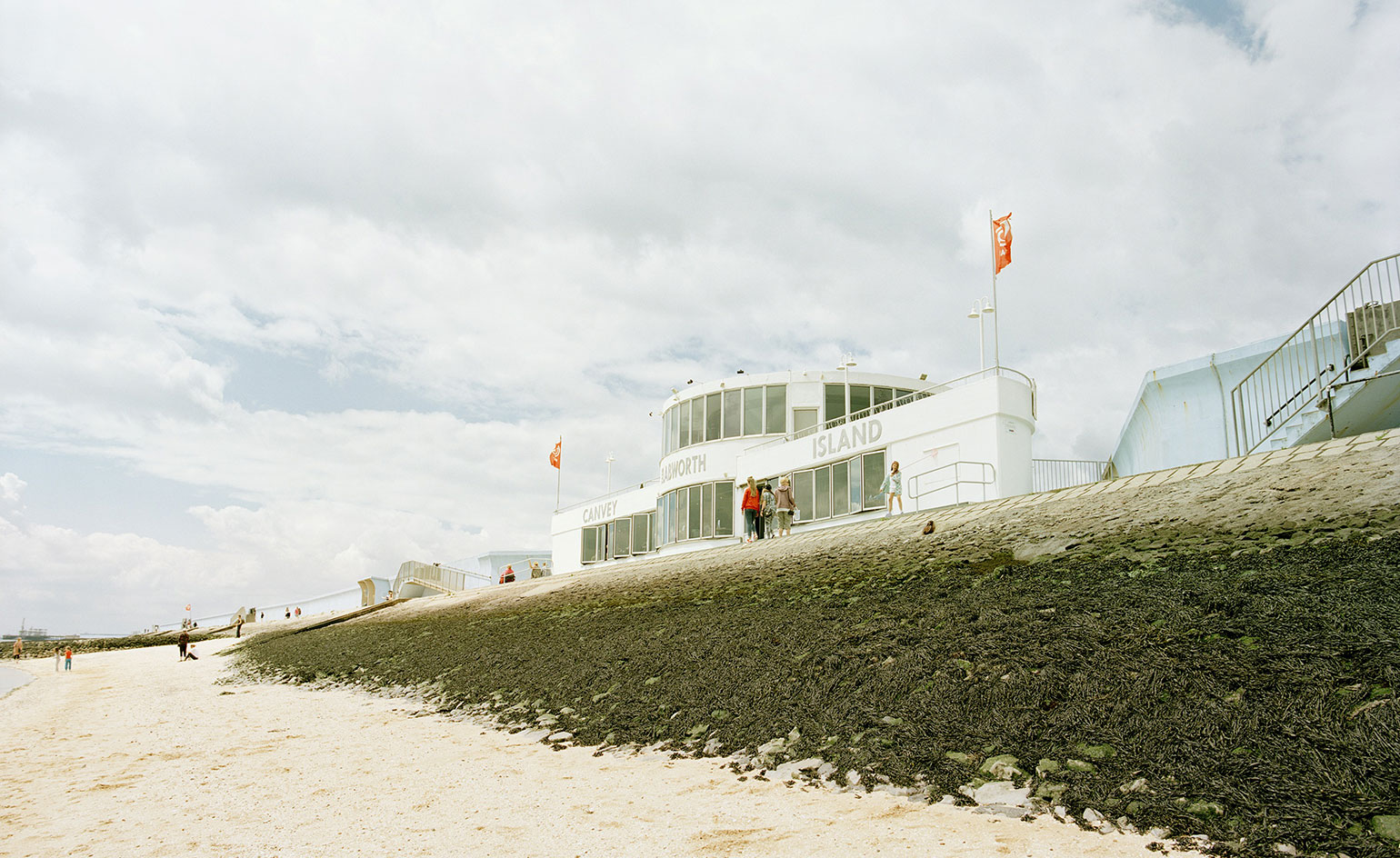White building overlooking beach