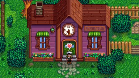 Stardew Valley - a player uses a heart emote in front of a complete community center