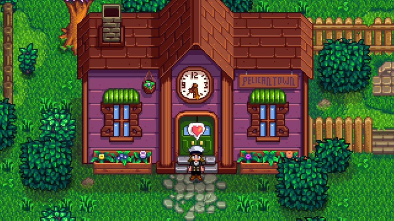 Stardew Valley - a player uses a heart emote in front of a complete community center