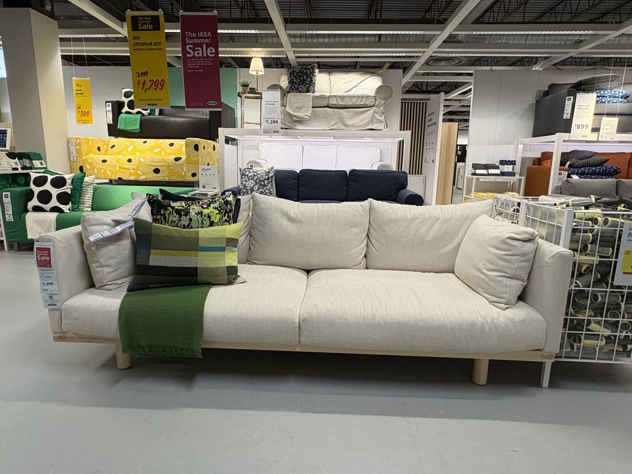 a white sofa from IKEA sits in a showroom.