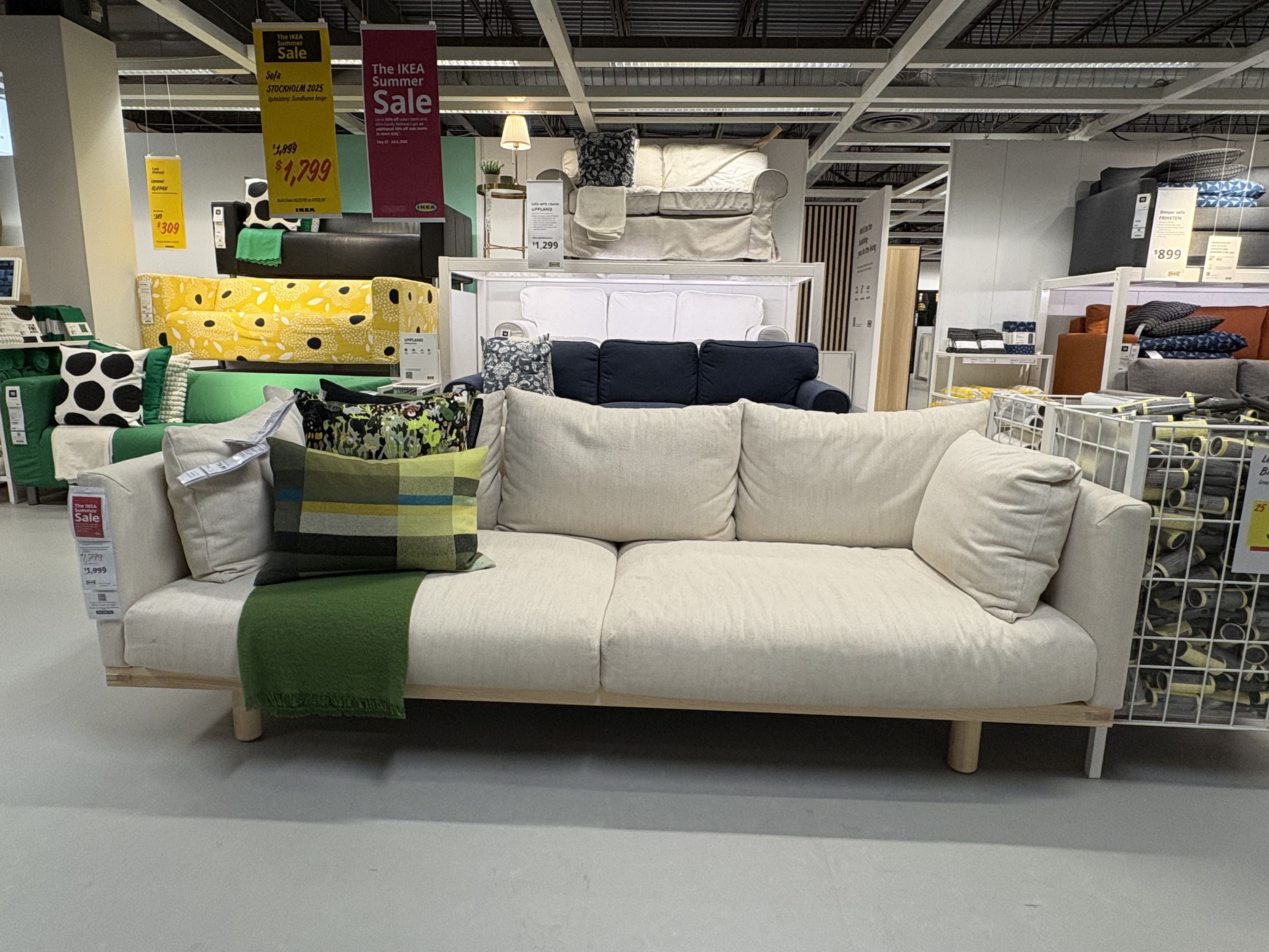 a white sofa from IKEA sits in a showroom.
