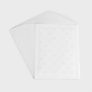 Sheets of white Celine Haute Parfumerie scented paper