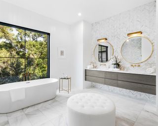 White color drenched bathroom with freestanding tub