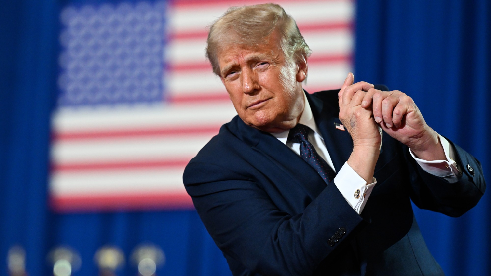 Trump dances on stage at an event in New York