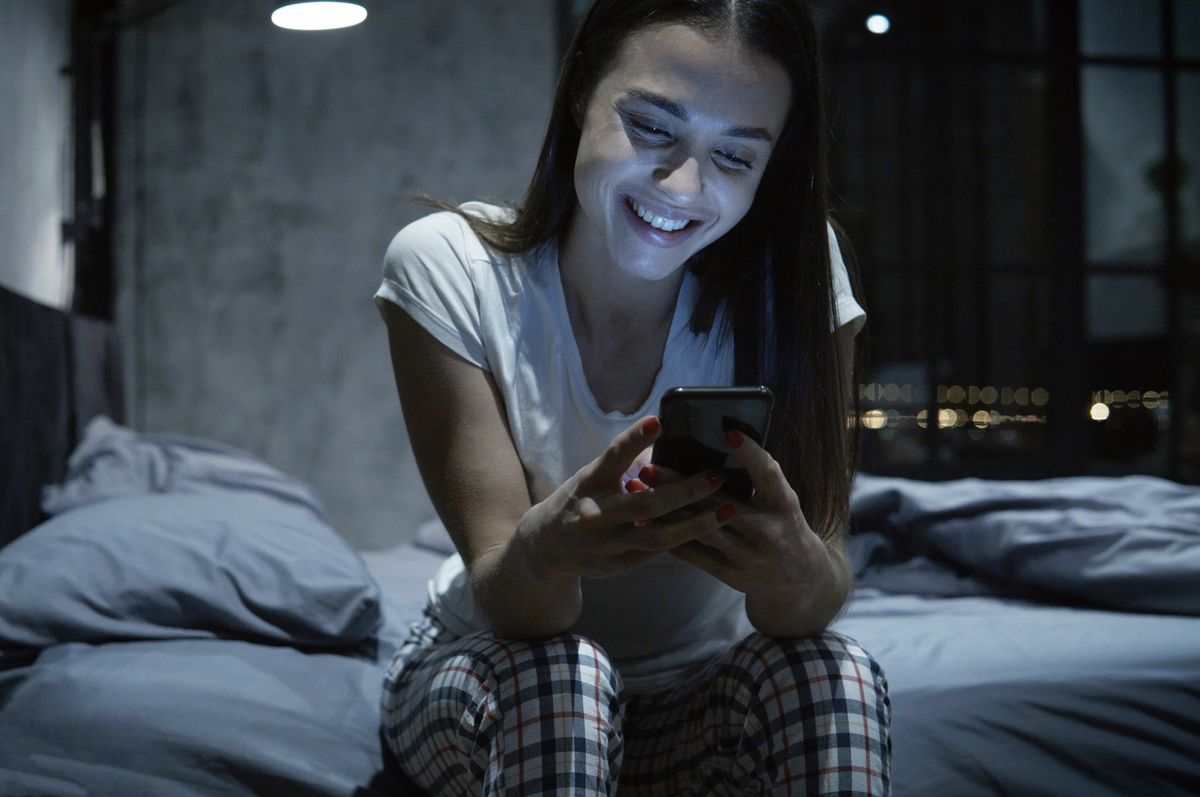 woman making video call in the dark