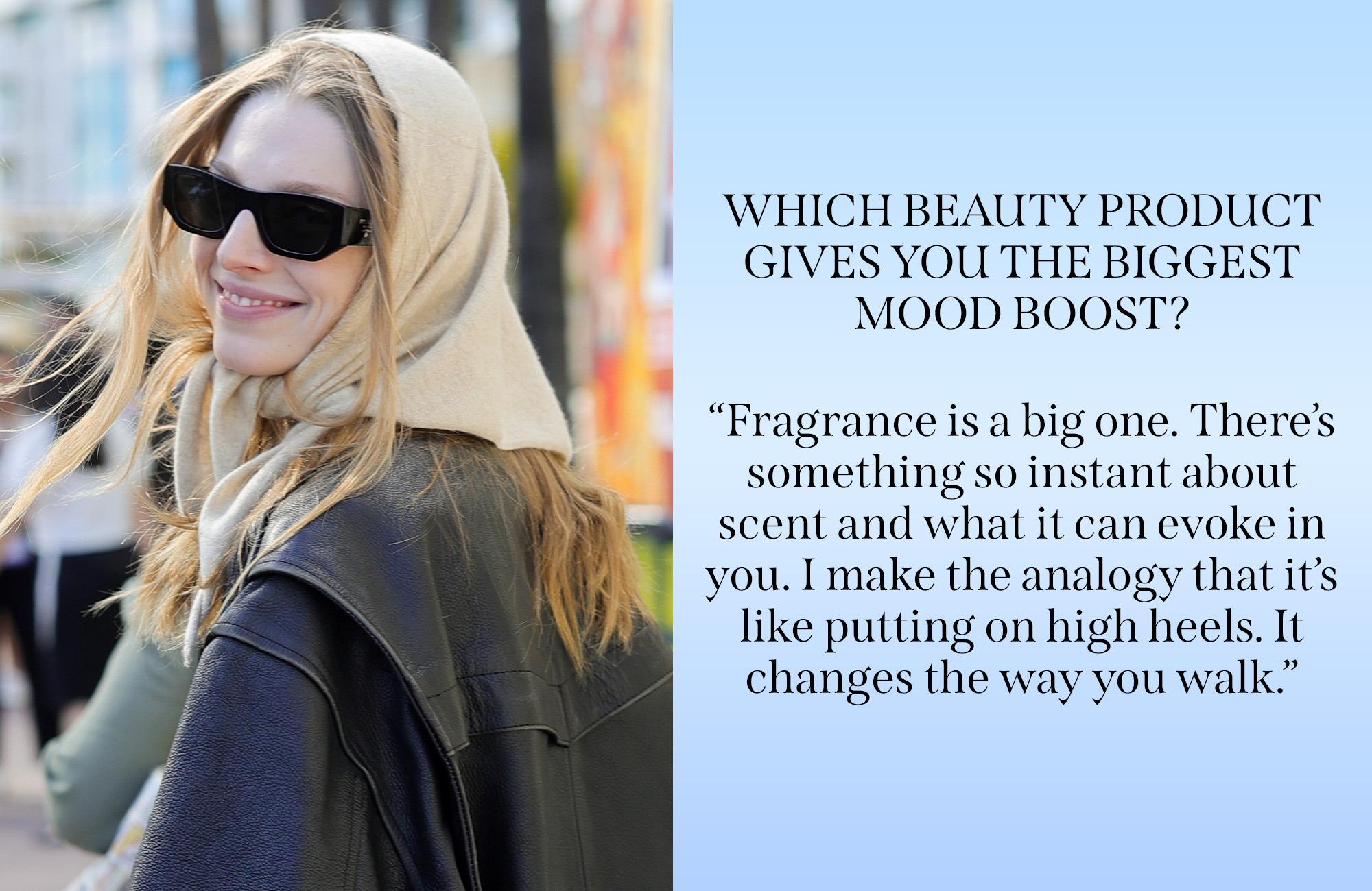 Hunter Schafer wearing a scarf and sunglasses smiling at the camera
