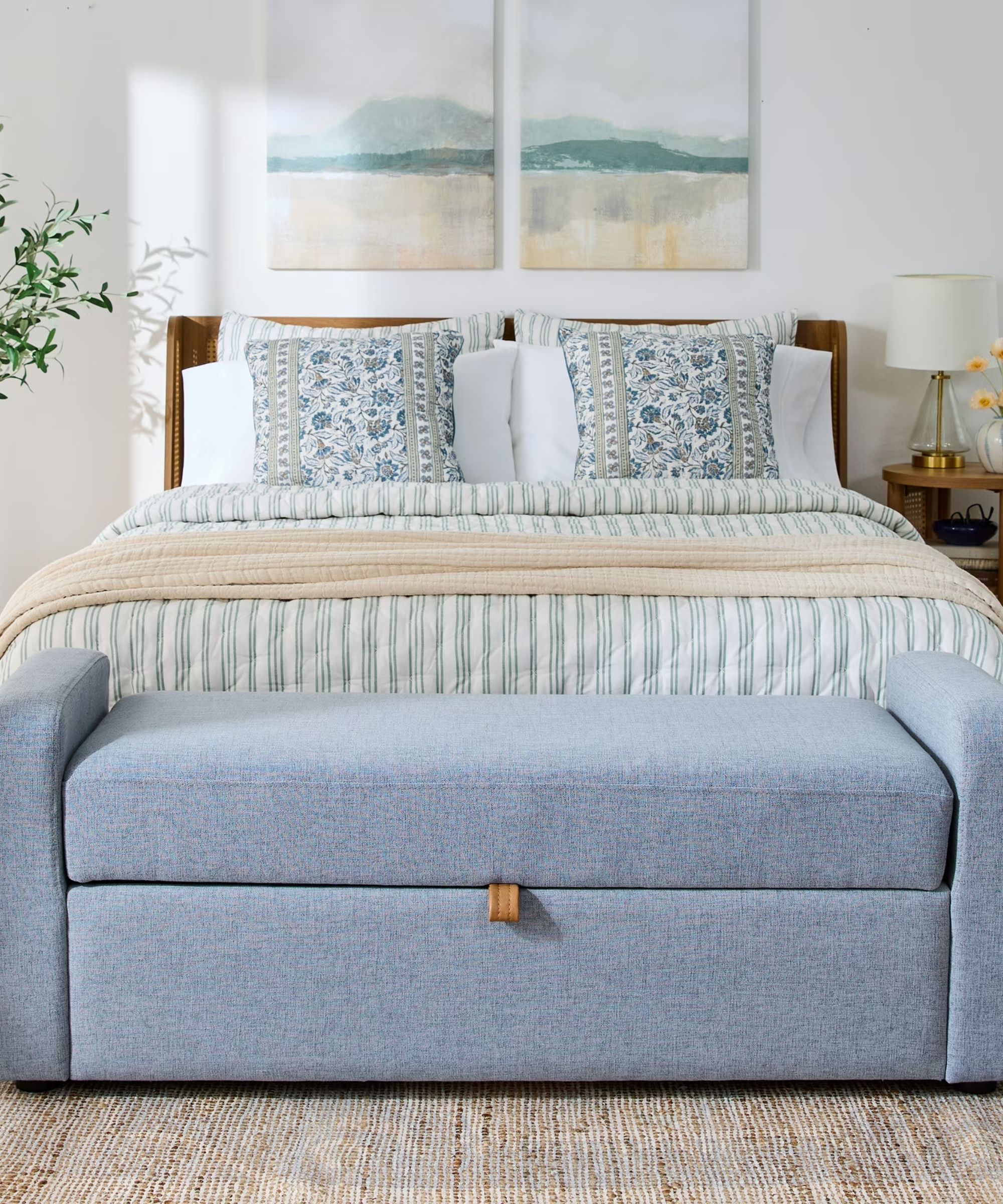 neutral coastal meets cottage bedroom with a light blue ottoman bench