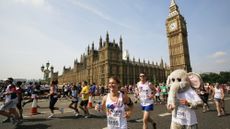 Fun runners competing in the London Marathon outside the Houses of Parliament